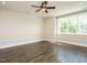 Spacious bonus room with wood floors, ceiling fan, and large window with natural light at 2013 Woodbluff Dr, Wendell, NC 27591