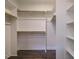 This closet has wooden rods and shelves and hardwood floors at 2013 Woodbluff Dr, Wendell, NC 27591