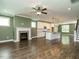 Open concept living room and kitchen area with hardwood floors, a fireplace and a center island at 2013 Woodbluff Dr, Wendell, NC 27591