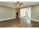 The room features hardwood floors, neutral walls, sliding glass doors, ceiling fan, and lots of natural light at 2013 Woodbluff Dr, Wendell, NC 27591