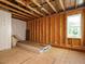 An unfinished room featuring exposed wood and bright window at 2013 Woodbluff Dr, Wendell, NC 27591