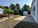 The backyard has a patio, mature trees, and a shed for extra storage at 205 Bog Hill Ln, Cary, NC 27519