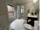 Bathroom with tiled floors, wood blinds, and a double sink vanity at 205 Bog Hill Ln, Cary, NC 27519