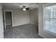 Spacious bedroom features neutral walls, gray carpet, and a ceiling fan with lighting at 205 Bog Hill Ln, Cary, NC 27519