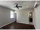Bedroom with hardwood floors, a ceiling fan, and an ensuite bathroom at 205 Bog Hill Ln, Cary, NC 27519