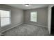 Bedroom with gray carpet and neutral walls, enhanced by natural light at 205 Bog Hill Ln, Cary, NC 27519