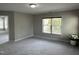 Bright and spacious bedroom features a window and door to another room at 205 Bog Hill Ln, Cary, NC 27519