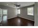 Bright bedroom with hardwood floors and windows letting in natural light at 205 Bog Hill Ln, Cary, NC 27519