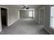 Spacious bedroom features neutral walls, plush gray carpet, and a ceiling fan at 205 Bog Hill Ln, Cary, NC 27519