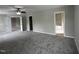 Large bedroom features gray carpet, neutral walls, and a bathroom entrance at 205 Bog Hill Ln, Cary, NC 27519