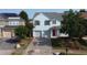 Charming home with a two-car garage, a red front door, and beautiful landscaping at 205 Bog Hill Ln, Cary, NC 27519