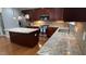 Gourmet kitchen showcases granite counters, a stainless steel range, and custom dark wood cabinetry at 205 Bog Hill Ln, Cary, NC 27519