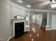 Open living space with hardwood floors, fireplace, and view to the front entrance at 205 Bog Hill Ln, Cary, NC 27519