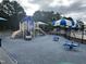 Community playground featuring slide, climbing features, and spring riders at 205 Bog Hill Ln, Cary, NC 27519
