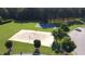 Aerial shot of volleyball court with swing set and parking area nearby at 205 Bog Hill Ln, Cary, NC 27519
