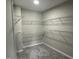 Walk-in closet with ample wire shelving and gray carpeting at 205 Bog Hill Ln, Cary, NC 27519