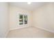 Bright bedroom with neutral carpeting and a window at 209 Homegate Cir, Apex, NC 27502