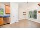 Bright dining area with tile flooring and stainless steel dishwasher at 209 Homegate Cir, Apex, NC 27502