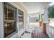 Charming covered front porch featuring rocking chairs and wood flooring at 209 Homegate Cir, Apex, NC 27502