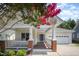 Inviting front porch with rocking chairs offering a relaxing outdoor space at 209 Homegate Cir, Apex, NC 27502