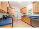 Well-lit kitchen with stainless steel appliances and ample cabinet space at 209 Homegate Cir, Apex, NC 27502