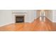 Open-concept living room featuring a fireplace and hardwood floors at 209 Homegate Cir, Apex, NC 27502