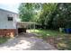 This property has a large backyard and a covered area to park vehicles at 2100 Breeze Rd, Raleigh, NC 27608