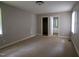 Spacious bedroom with neutral walls and walk-in closet at 2100 Breeze Rd, Raleigh, NC 27608