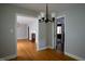 Classic dining space features hardwood floors and elegant lighting at 2100 Breeze Rd, Raleigh, NC 27608