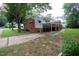 Back exterior view of the home, showing the backyard and the covered parking area at 2100 Breeze Rd, Raleigh, NC 27608