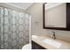 Bathroom featuring a vanity with cultured marble top, a sink, and a bathtub with shower at 211 Hills Of The Haw Rd, Pittsboro, NC 27312
