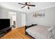 Bedroom featuring hardwood floors, a ceiling fan, and crown molding at 211 Hills Of The Haw Rd, Pittsboro, NC 27312
