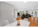 Open concept living space boasts hardwood floors, a fireplace, and comfortable seating, perfect for entertaining at 211 Hills Of The Haw Rd, Pittsboro, NC 27312