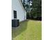 Well-maintained backyard featuring a lush green lawn and mature trees, offering a serene outdoor space at 2116 Tanglewood Rd, Rocky Mount, NC 27804