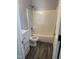 This full bathroom features a white vanity, granite countertop, and a shower and tub combo at 2116 Tanglewood Rd, Rocky Mount, NC 27804