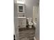 This bathroom features a white vanity, granite countertop, and a shower and tub combo at 2116 Tanglewood Rd, Rocky Mount, NC 27804