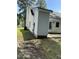 The home's exterior showcases a backyard patio area, clean white siding, and mature lawn and landscaping at 2116 Tanglewood Rd, Rocky Mount, NC 27804