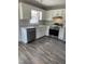 Modern kitchen featuring stainless steel appliances, white cabinets, and granite countertops at 2116 Tanglewood Rd, Rocky Mount, NC 27804