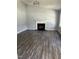 Spacious living room featuring gray walls, fireplace, and stylish gray floors at 2116 Tanglewood Rd, Rocky Mount, NC 27804