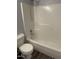 This bathroom features a shower and tub combo with white tile and modern fixtures at 2116 Tanglewood Rd, Rocky Mount, NC 27804