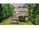 An aerial view shows the back exterior with a deck, patio and a well-manicured yard at 212 Heidinger Dr, Cary, NC 27511