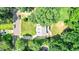 A picturesque aerial shot of a home nestled amongst beautiful, mature trees in a quiet neighborhood at 212 Heidinger Dr, Cary, NC 27511