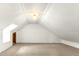 Large attic featuring bright natural light, carpeted floor and white paneled walls at 212 Heidinger Dr, Cary, NC 27511