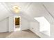 Attic featuring white paneled walls and a dormer window at 212 Heidinger Dr, Cary, NC 27511