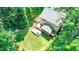 Aerial view of backyard with deck, patio, fire pit, and well-maintained lawn at 212 Heidinger Dr, Cary, NC 27511