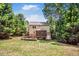 The backyard features an outdoor fire pit with seating and a covered deck at 212 Heidinger Dr, Cary, NC 27511