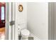 Powder room boasts tile floors, ornate mirror, and charming details at 212 Heidinger Dr, Cary, NC 27511