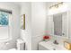 Well-lit bathroom with a modern vanity, decorative accents, and a window for natural light at 212 Heidinger Dr, Cary, NC 27511