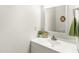 Updated bathroom with stylish vanity and a decorative mirror at 212 Heidinger Dr, Cary, NC 27511