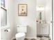 A well-lit bathroom features a toilet, stylish decor, and a modern vanity at 212 Heidinger Dr, Cary, NC 27511